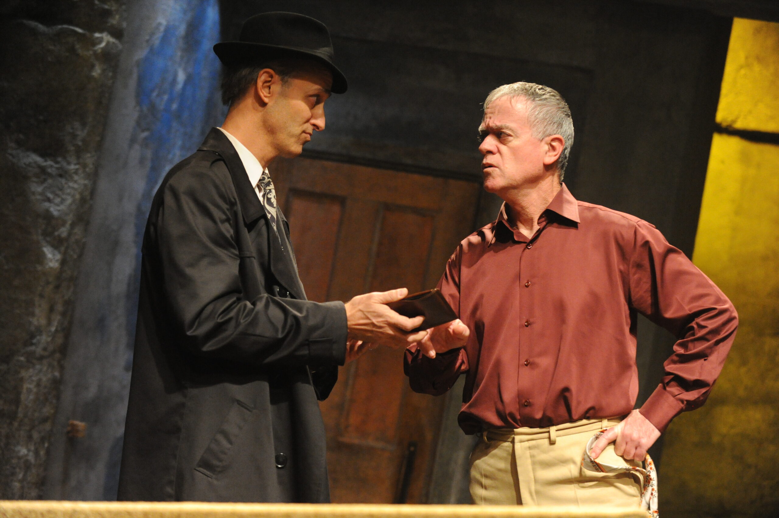 Private investigator reviewing evidence and documents with a client